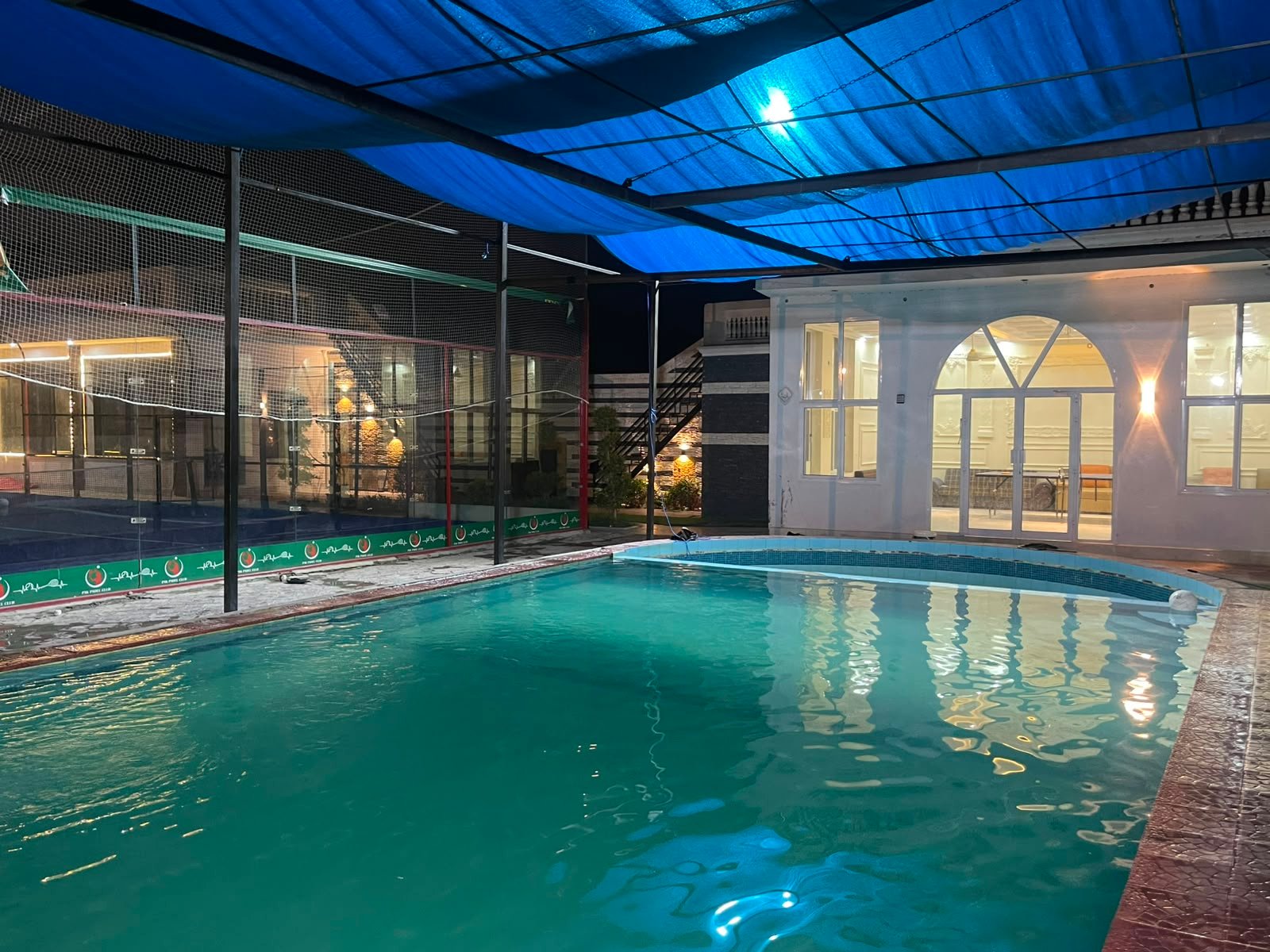 Covered swimming pool at night