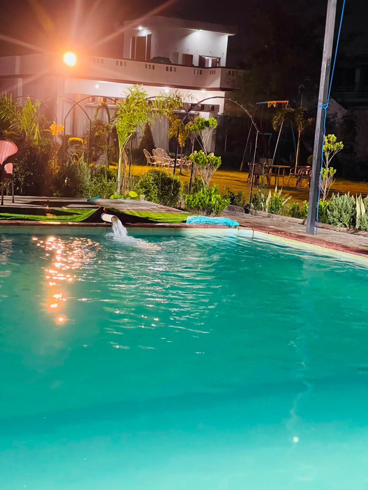 Pool with garden view at night