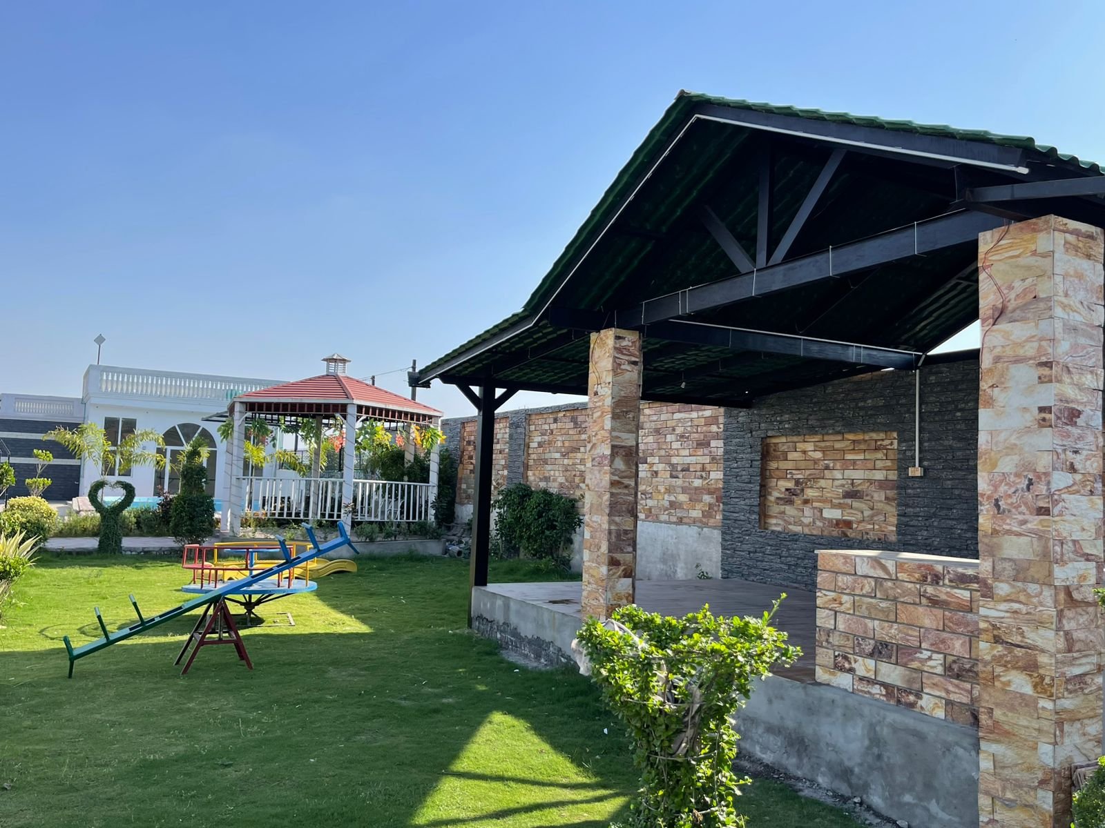 Garden with gazebo and kids play area