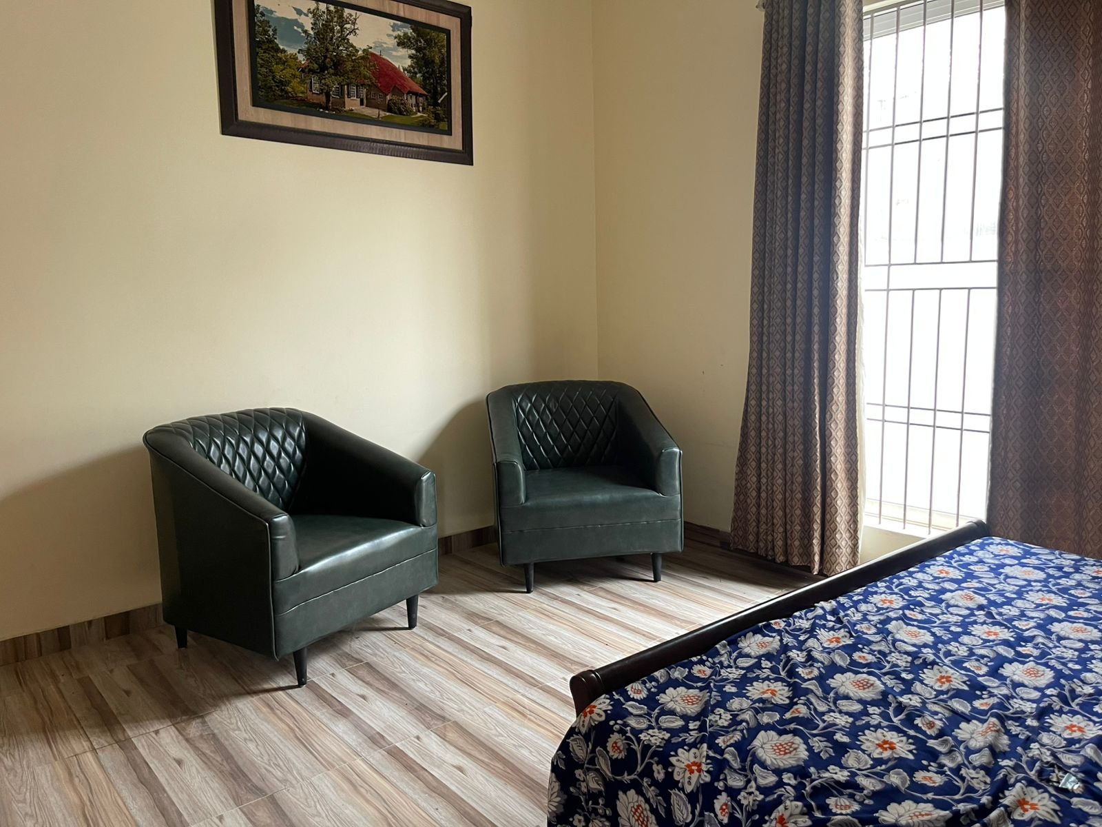 Guest bedroom with armchairs