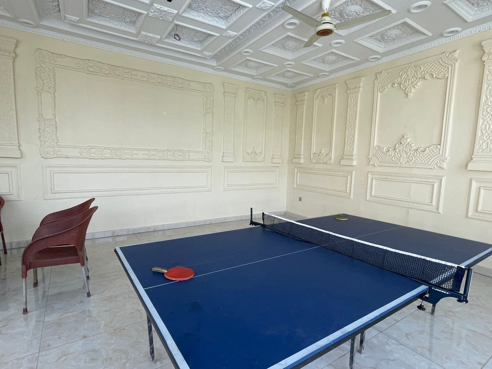 Table tennis in ornate hall